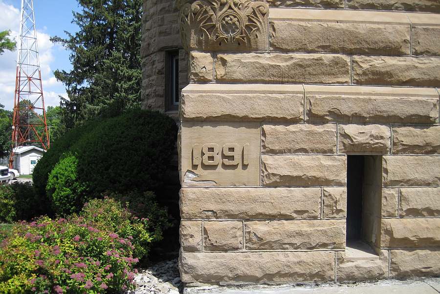 Cornerstone, at the bottom of the clock tower.